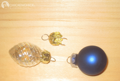 Christmas ornament caps can be inserted in the holes on the end of blown, decorated eggs 