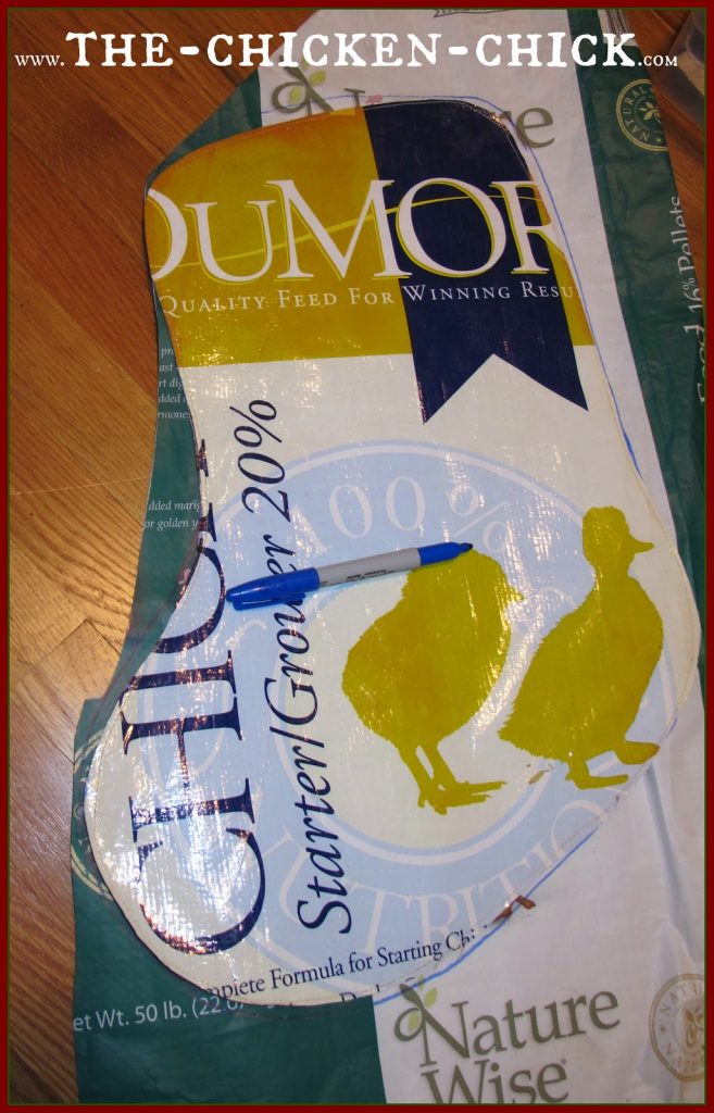 Place permanent template on top of a feed bag and trace around with a permanent marker, pin inside the stocking outline, cut out stocking and sew closed.