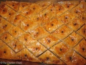 Baklava is a traditional Greek dessert made with phyllo dough, walnuts and a special syrup. It is best made well in advance of serving so the ingredients have time to soak into the phyllo dough. Mmmm