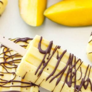Chocolate Drizzled Mango Yogurt Pops shared by Spoonful of Flavor
